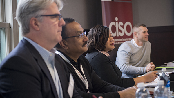 Students in the CISO class listen to an instructor