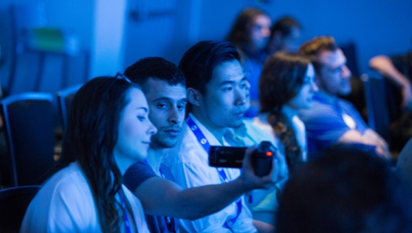 Students sitting in a theater working with a film camera at the SXSW Festival