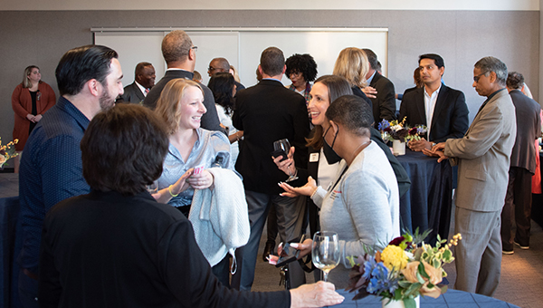 A group chats together during a social gathering.