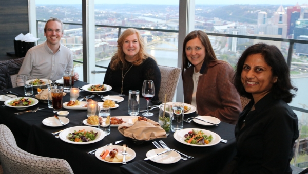 Executive Ed people seated at dinner table