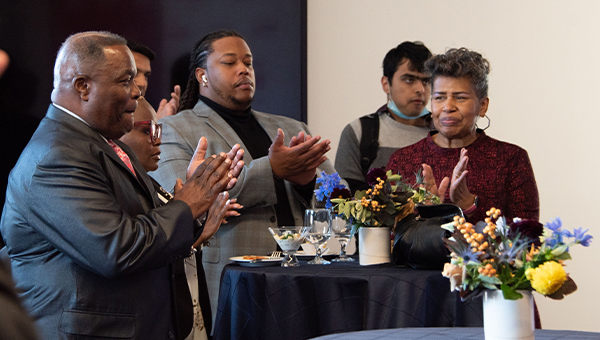 People stand together at an event.