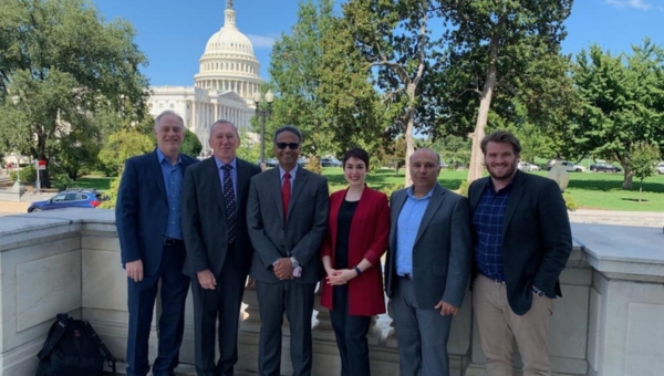 Block Center faculty and staff standing together in a line outside the U.S. Capitol Building