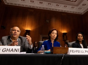 Professor Rayid Ghani sits at a table during his testimony.