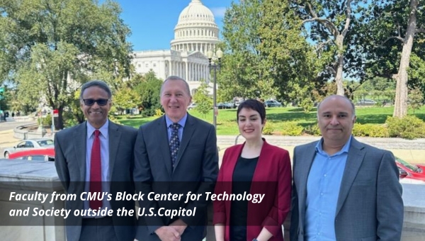 Block Center faculty are standing outdoors in front of the U.S. Capitol Building. From left to right, Dean Ramayya Krishnan, Tom Mitchell, Hoda Heidari, and Rayid Ghani.