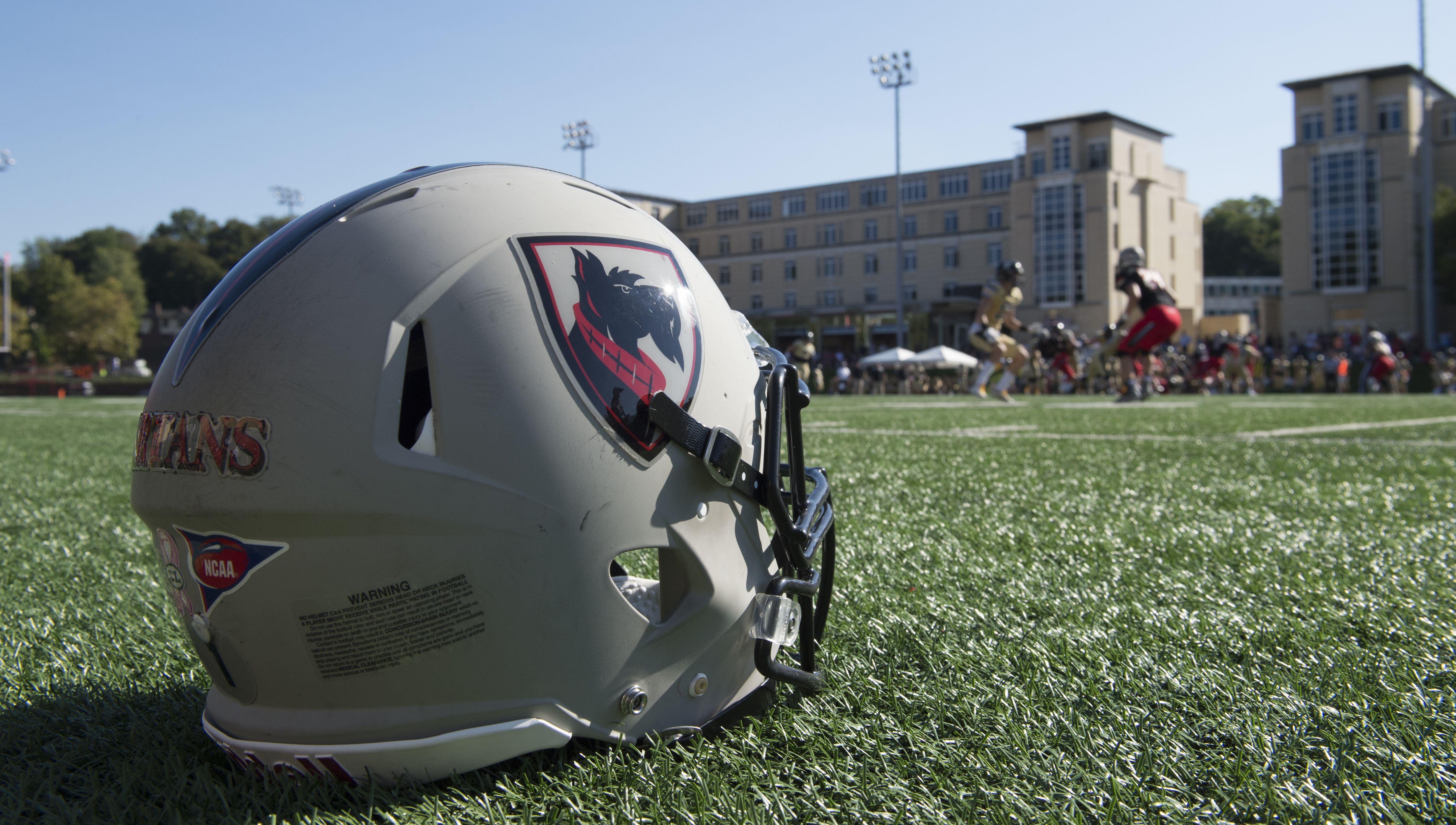 Carnegie Mellon football helmet resting on the sidelines as the football team plays a game