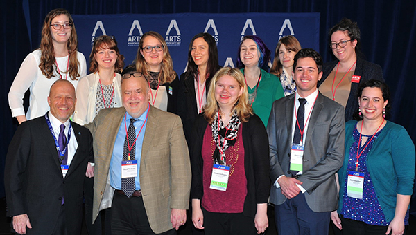 A group of MAM students at a conference