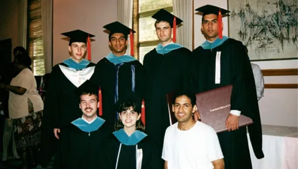 Eli Potter among a group of friends at their graduation
