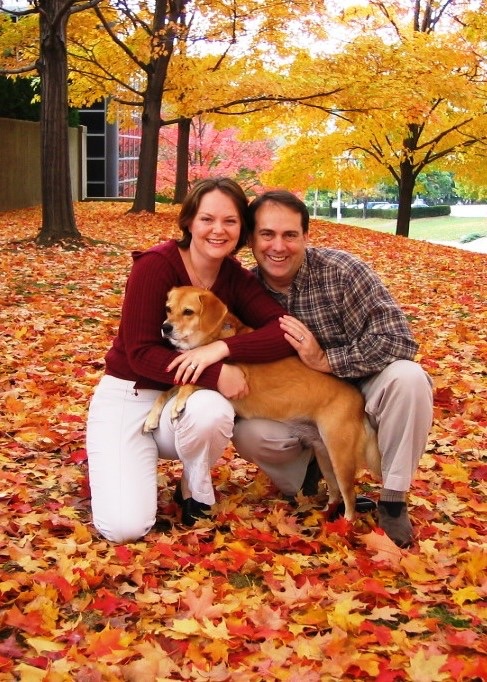Jutta and Cary Williams, with Sunny thedog, outside on a fall day.