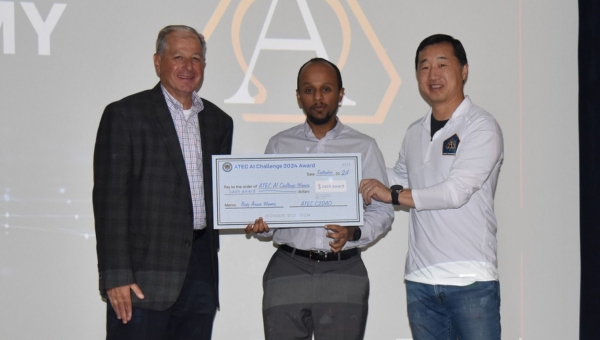 AI Challenge Winner: Young Bang (right), principal deputy assistant secretary of the Army for Acquisition, Logistics and Technology, presented to the award for winning the 2024 ATEC AI Challenge to Fikru Gennese (center) of Team "No to Destructive Testing," along with James Amato (left), ATEC executive technical director.