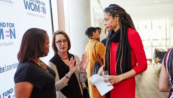 Zwart chats with other women at a professional gathering.