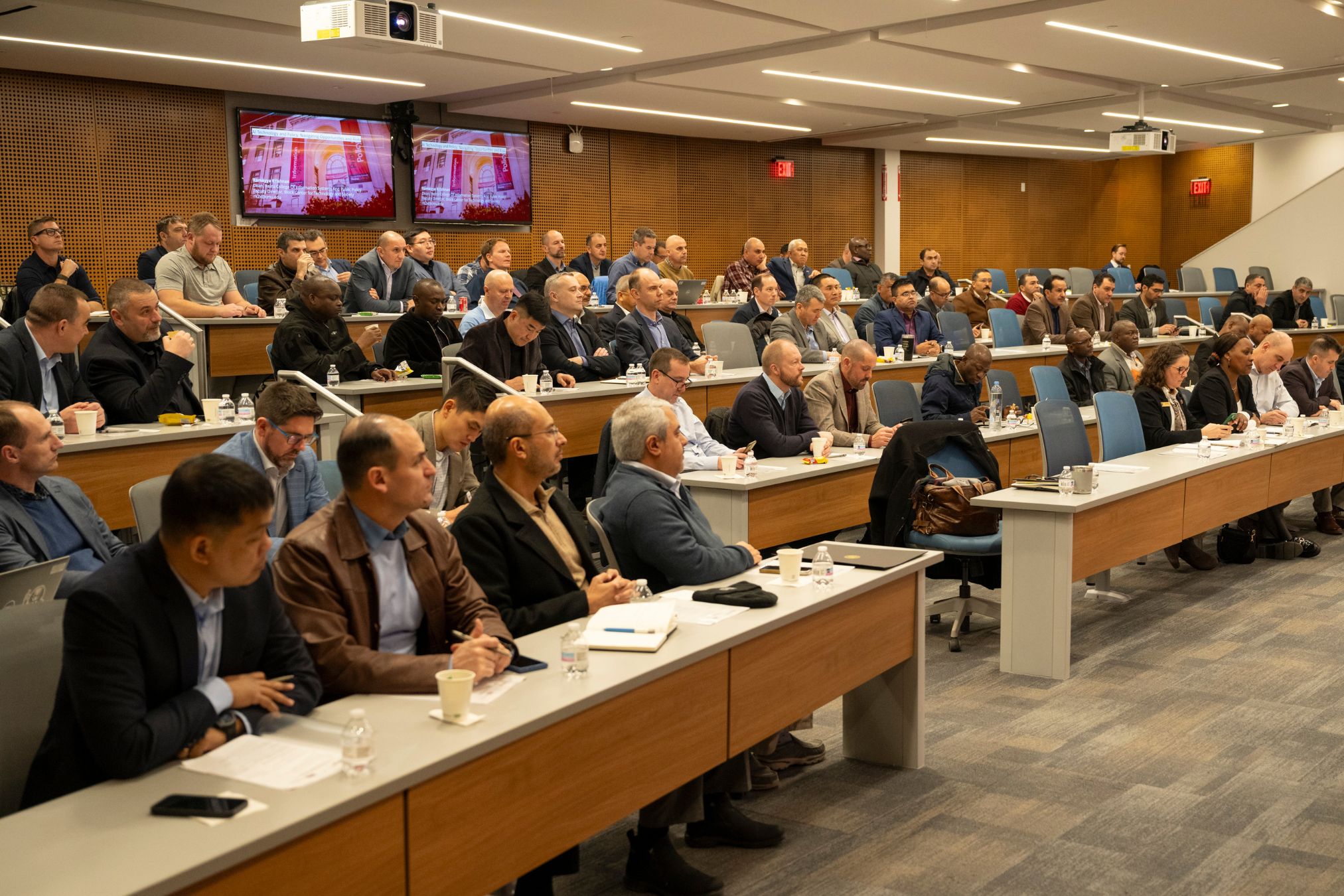 Participants listen to a presentation.