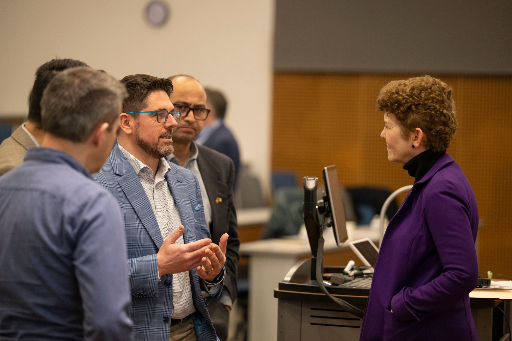 Participants talk with Audrey Korth Cronin