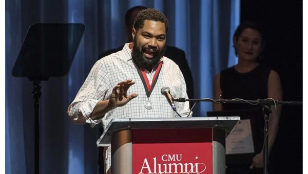 Tommy Oliver receives an award from Carnegie Mellon University