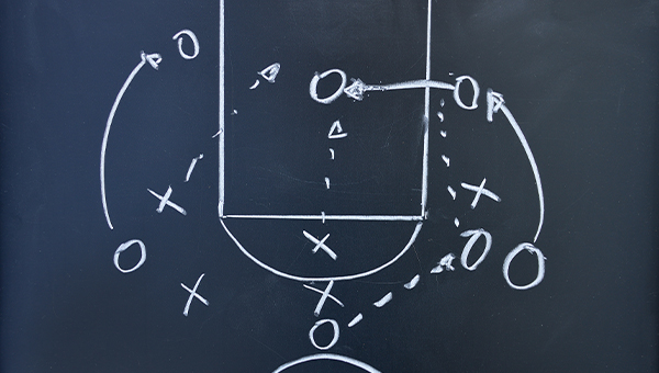 Playbook on chalk board for a basketball play