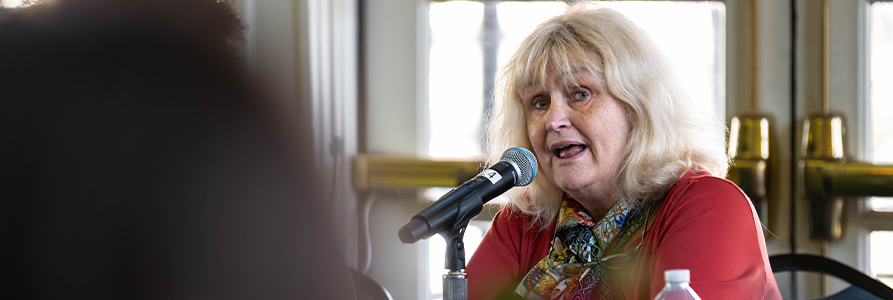 Denise Rousseau speaks during a panel discussion.